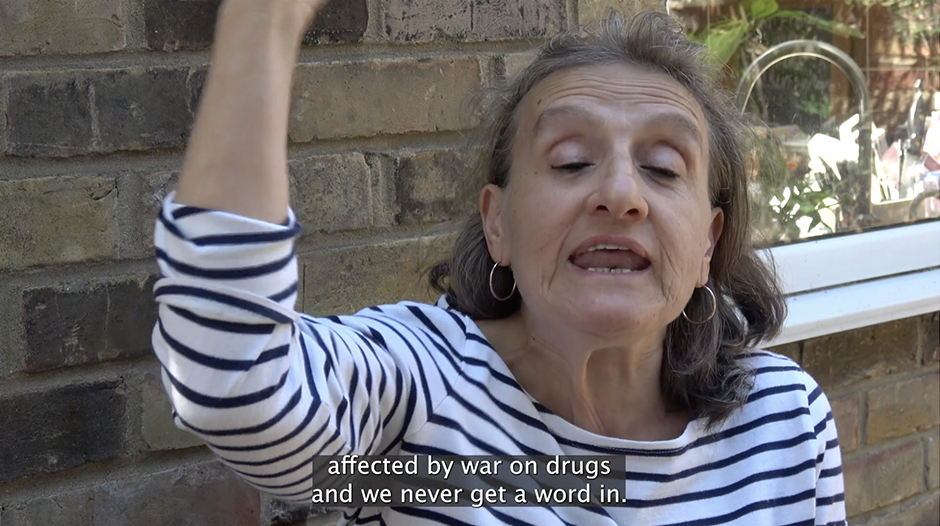 A very animated Andria, talking passionately in front of a brick wall