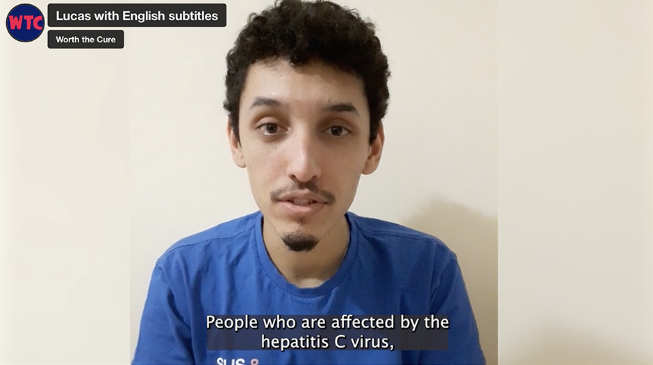 A video still of Lucas - a young Brazilian man with dark curly hair, a small beard and a moustache.